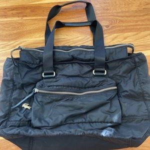 Lacoste black nylon and leather bag.